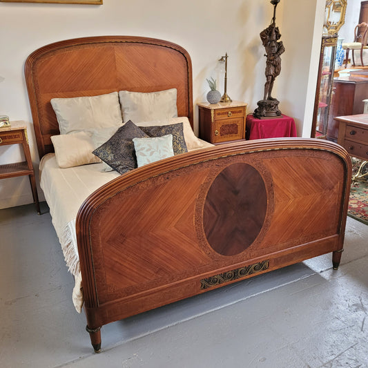 French Art Deco Walnut queen size bed with bronze mounts. Bed comes complete with custom made slats. Just place your mattress on top. Sourced from France and in good original detailed condition.
