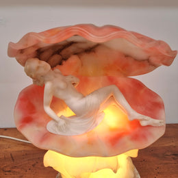 A superb original hand carved Art Deco lamp. Alabaster and marble sculpture of a nude woman inside a clam shell. Italian, inscription to base. Circa 1920's. Subtle colouring to clam shell for a sunset effect. This is a world class example of a true Art Deco sculpture lamp. It is in good original detailed condition, please view photos as they help form part of the description.