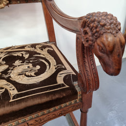 Beautifully carved Walnut Egyptian Revival armchair with amazing hand sewn Stumpwork embroidery coverings. In good original detailed condition.