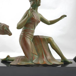 Absolutely gorgeous French cold painted metal Art Deco Statue of a lady and two deers on a marble base. Signed piece and in good original condition.