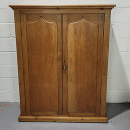 A lovely Victorian Pine shield cupboard with two doors and four shelves in good original detailed condition.