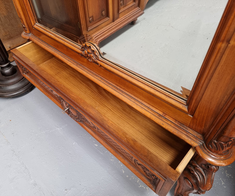 French single door Walnut Louis XV style armoire with mirrored door. In good orignal detailed condition.