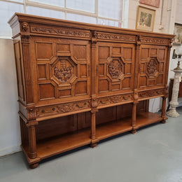 Impressive and grand French Oak Renaissance style sideboard. Beautifully detailed carvings and plenty of storage with three very large cupboards with a total of eight adjustable shelves along with three large drawers. It has been sourced from France and is in very good original detailed condition.