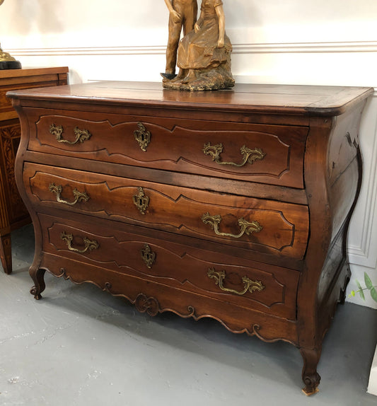 Beautiful 18th Century French all Cherrywood three drawer commode with beautiful ormolu mounts and handles. It is in good original detailed condition.