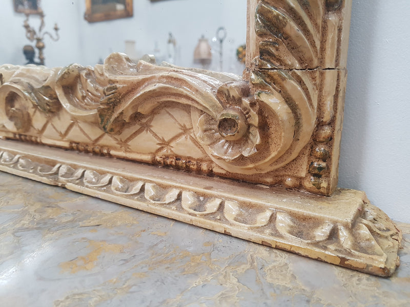 Beautifully carved Italian Rococo style painted console/hall table and mirror. An amazing coloured marble top showing sections of gold veins and is in good condition. Mantle mirror is retaining it's original mirror and showing ages spots.