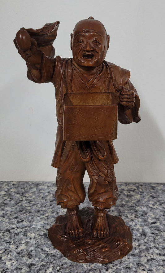Exceptional Japanese Meiji period boxwood carving of a Peach Seller. Circa 1880's and it is signed to base. It is in good original condition, please view photos as they help form part of the description.