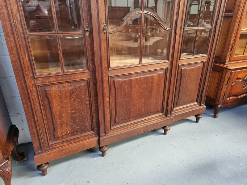 Late 19th Century French Oak three door bookcase. It has fully adjustable shelfs and is in good original detailed condition.