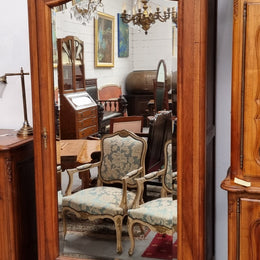 French Louis XV style Walnut armoire with single bevelled mirrored door. It has four adjustable shelves and a hidden exterior drawer at the bottom. It has been sourced from France and is in good original detailed condition.