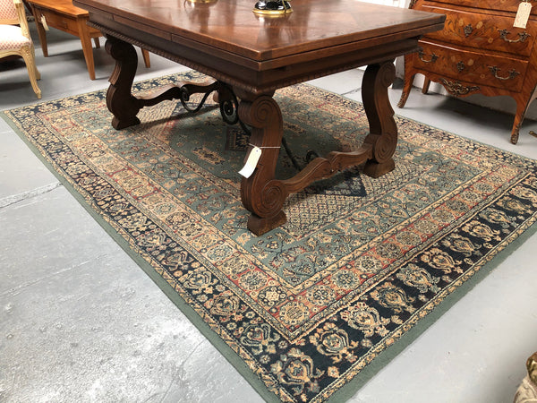 A beautiful coloured Turkish Rug with shades of green, teal, navy and rust in good condition.