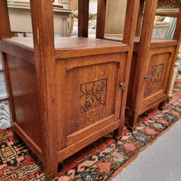 Charming pair of French Oak Arts and Crafts bedsides with shelf, cupboard with carving and marble top.  They have been sourced from France and are in good original detailed condition.