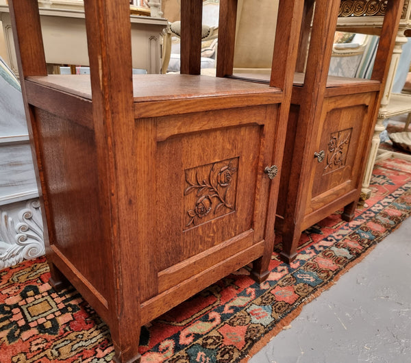 Charming pair of French Oak Arts and Crafts bedsides with shelf, cupboard with carving and marble top.  They have been sourced from France and are in good original detailed condition.