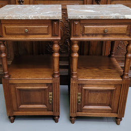 Pair of French Antique Oak marble top bedsides Henry II style. They have a drawer, cupboard and an open shelf for all your storage needs. They have been sourced from France and are in good original detailed condition.