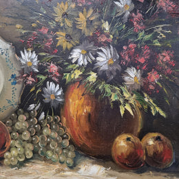 Beautiful signed oil on canvas of a still life framed in an ornate frame. Sourced in France and in good original condition.