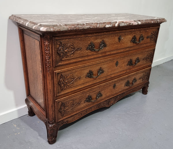 French Louis XV style three drawer Oak marble top commode. In good original detailed condition.