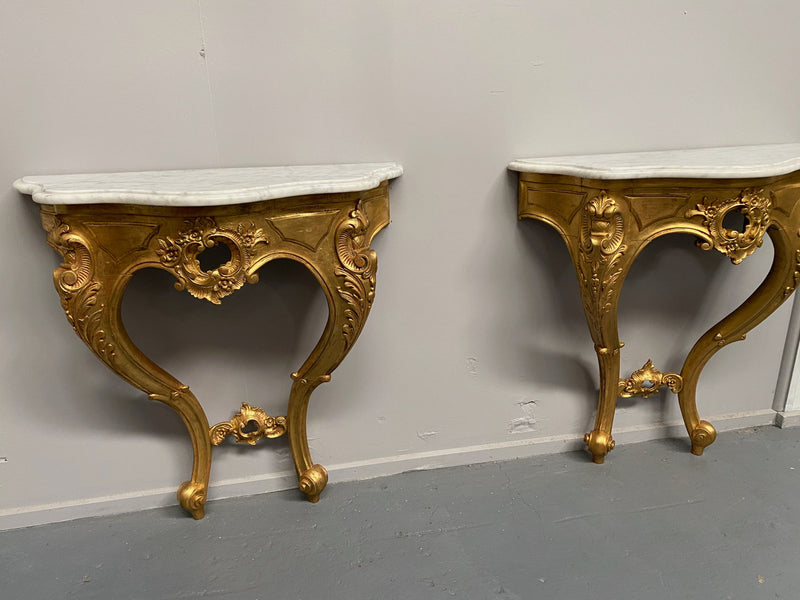 Rare Pair Of Antique carved gilt wood & marble top console tables. They are "wall mounted".
