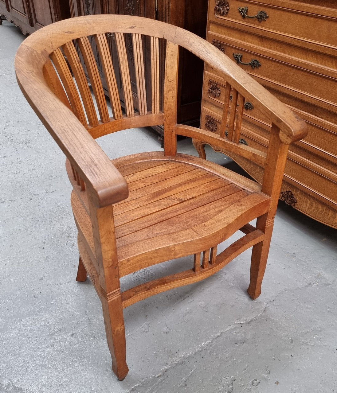 Vintage teak "Captains Chair". It is well built and very comfortable to sit in. It is in good original detailed condition.