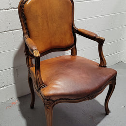 French Walnut Louis XV style desk chair with faux leather upholstery. The upholstery is in good original condition and very comfortable to sit in.