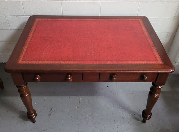 Victorian Cedar two drawer tooled leather topped desk with turned legs. In good original condition.