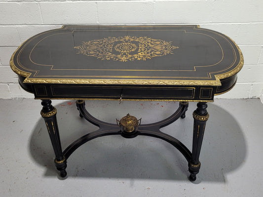 19th Century Napoleon III boulle ebonized centre table. Beautiful decorative mounts and has a drawer on one side. In good restored condition.