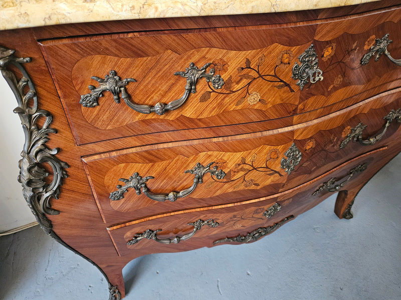 Stunning French Louis 15th style marble topped three drawer commode with marquetry inlay and stunning ormolu mounts. In good original detailed condition.