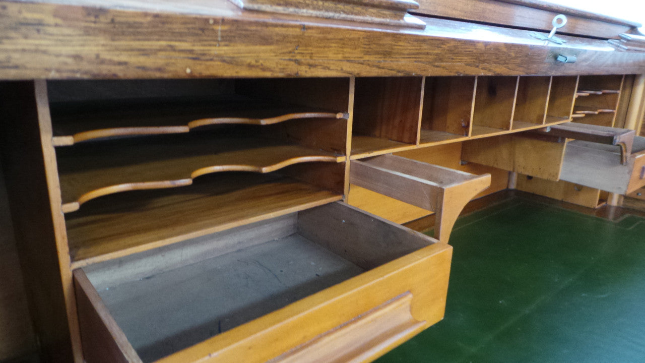 An Antique English Oak Roll Top Desk