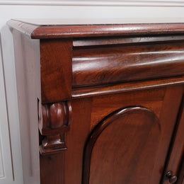 Cedar side cabinet with two doors one drawer and lovely door panels and corbels. It has been sourced locally and is in good original detailed condition.