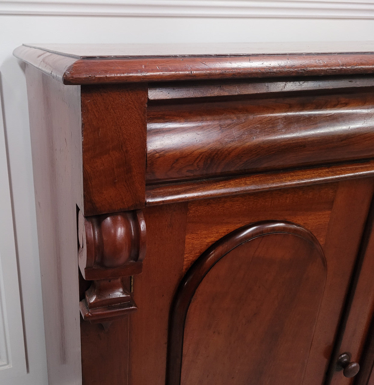 Cedar side cabinet with two doors one drawer and lovely door panels and corbels. It has been sourced locally and is in good original detailed condition.