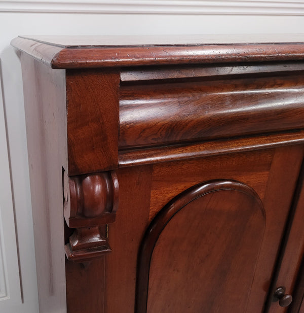 Cedar side cabinet with two doors one drawer and lovely door panels and corbels. It has been sourced locally and is in good original detailed condition.