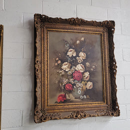 Attractive French floral oil on canvas - signed. Mounted in a stunning patterned gilded frame. It is in good original detailed condition.