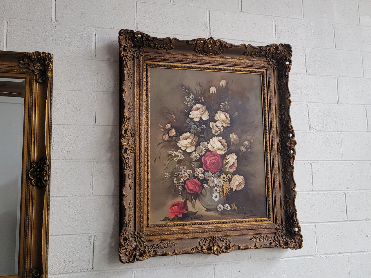 Attractive French floral oil on canvas - signed. Mounted in a stunning patterned gilded frame. It is in good original detailed condition.