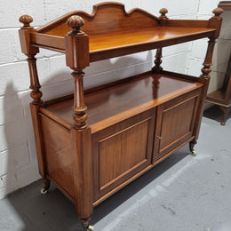 Victorian Mahogany Dumb Waiter with two cupboards, original casters in good detailed condition.