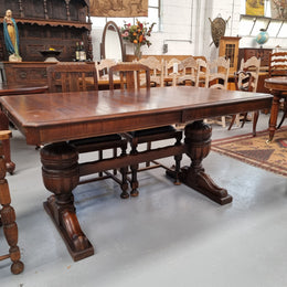 Tudor oak dining setting consisting of draw leaf extension table, 4 dining chairs and 2 carver chairs. Upholstery in excellent condition. Circa: 1930’s. The table, chair and carver chairs are in good original detailed condition.