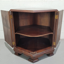 Hexagonal Mahogany enclosed side cabinet with two doors. Would make an ideal side cabinet and is in good restored condition.