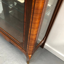 Beautiful French walnut and parquetry inlaid vitrine with lovely bevelled glass and a marble top. It comes with four glass shelves which are adjustable and it is in good original condition.