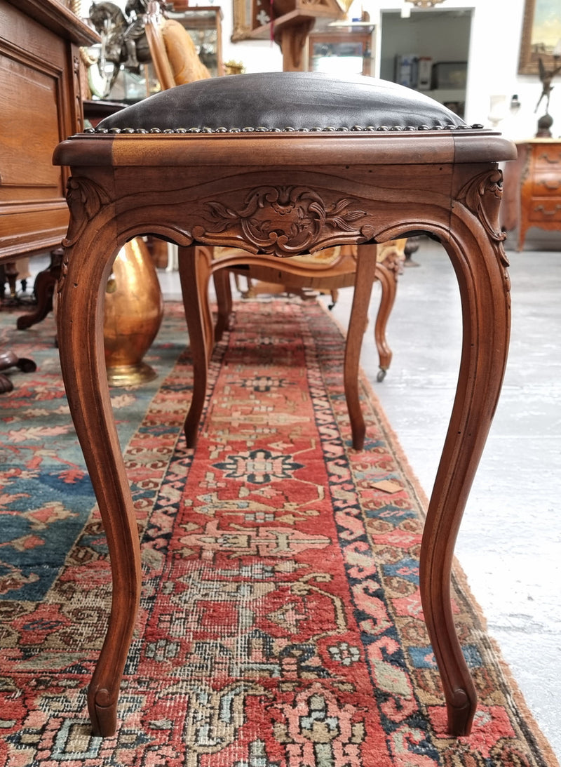 Impressive French Louis 15th style walnut upholstered duet leather stool. Very Good Condition.  Circa: 1930’s, sourced in France.