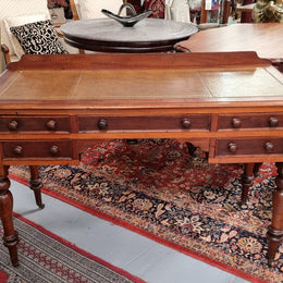 Lovely Victorian Cedar leather tooled  top desk, with five drawers on castors and of pleasing proportions. In very good original detailed condition and has been sourced locally.
