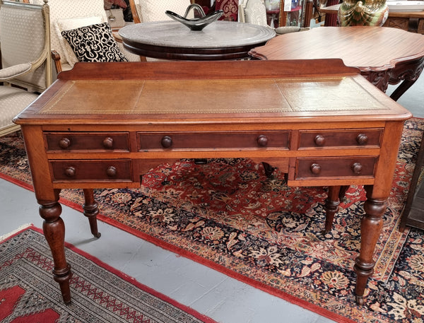 Lovely Victorian Cedar leather tooled  top desk, with five drawers on castors and of pleasing proportions. In very good original detailed condition and has been sourced locally.