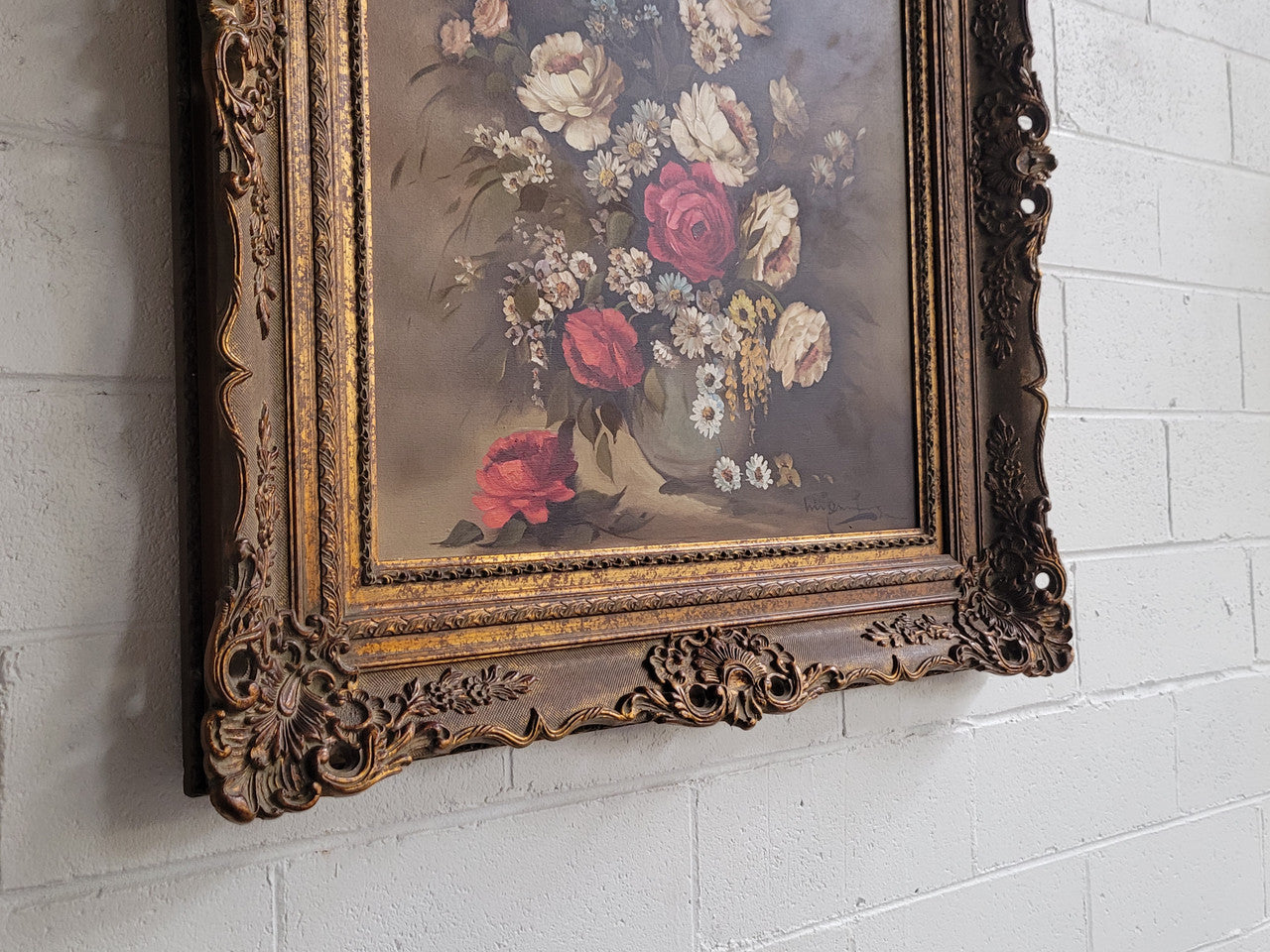 Attractive French floral oil on canvas - signed. Mounted in a stunning patterned gilded frame. It is in good original detailed condition.