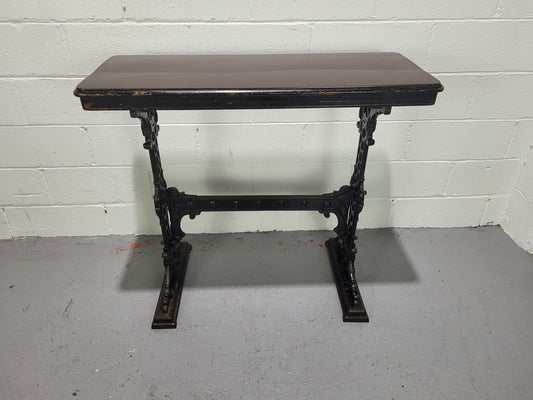 Late Victorian English Mahogany and cast iron base pub table. The foundry maker name is on the base and it is in good original detailed condition.
