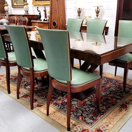 French Art Deco Figured Walnut dining table and six chairs. This stylish table also comes with a glass top and can be used with or without it. The chairs are very comfortable and the table can also fit another two chairs at either end making it a 6-8 seater. The table is in good original detailed condition with character marks to the top of table as shown in the pictures. This table and six chairs have been sourced locally.