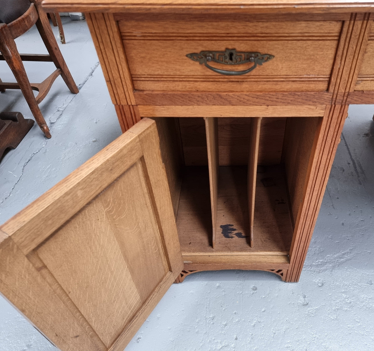 French Oak Art Deco full partners desk with leather top. Plenty of storage with both sides having three drawers at the top and two cupboards on both sides, one side has a filing section with three internal drawers and the other has a shelf on one side with three internal drawers as well. In good original detailed condition.