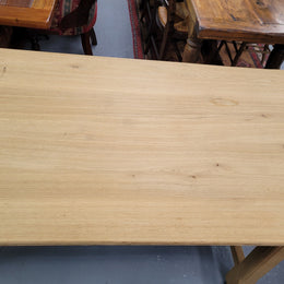 French raw Oak stretcher based refectory table. Features raw wood that could be used as is for a distressed look, or finished and waxed for a more refined look. Sourced from France and in good original condition.