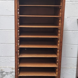 Antique Edwardian roll top Tambour file cabinet desk. This practical antique tambour front filing cabinet dates around 1900 in the Edwardian period and is constructed from Oak. This antique cabinet has an adjustable writing slope, above a tambour front with key and working lock. It has been sourced locally and is in good original detailed condition.