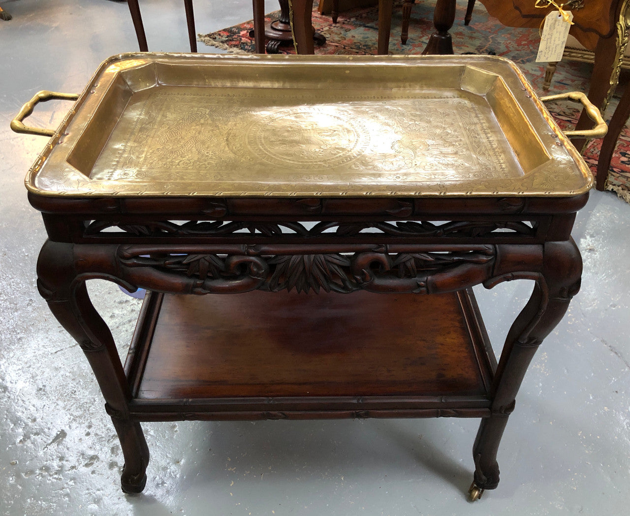 Victorian Rosewood auto/drinks trolley with a very decorative removable brass tray. In very good original detail condition.