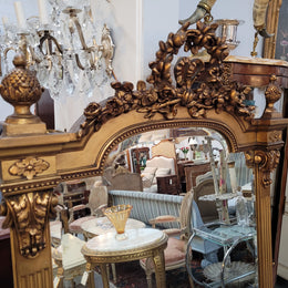 French Louis XVI style Napoleon III (1870’s) gilt mantle mirror. Beautifully carved and decorated with original bevelled mirror showing signs of age. It is in good original detailed condition and has been sourced from France.