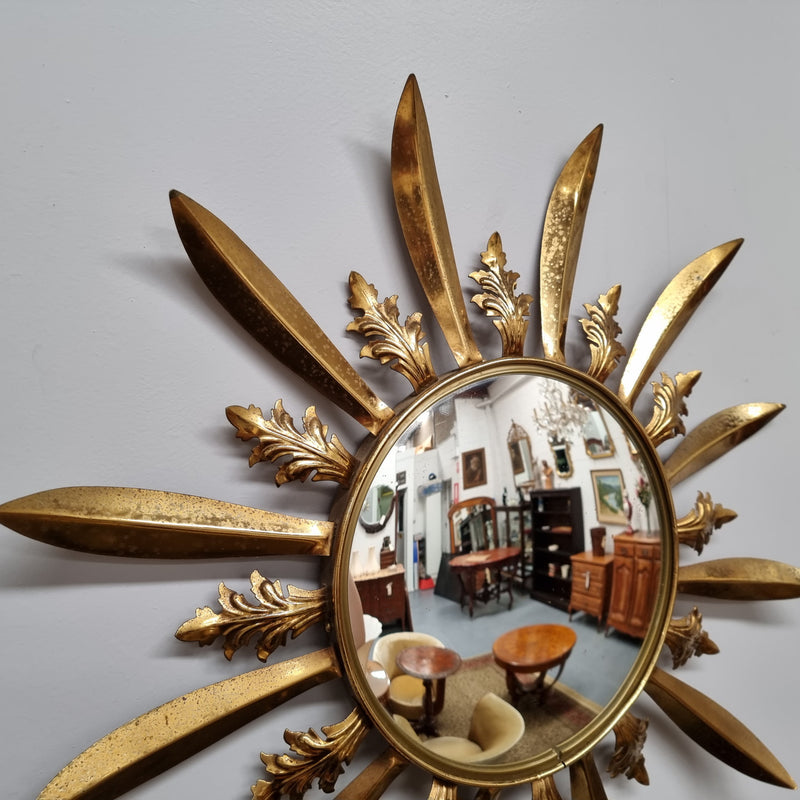 Stunning French Vintage gilt metal starburst convex mirror. It has been sourced from France and in good original detailed condition. Please note mirror does have some spotting due to age but only adds to its character.