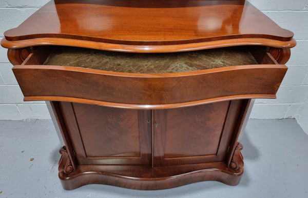 Beautiful Antique Victorian Mahogany two door Chiffonier. Plenty of storage space with one drawer and the two doors open up to a shelved area. It is in good restored condition.