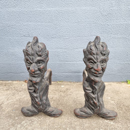 Fabulous rustic pair of French cast iron fire dogs. They are in good original condition.