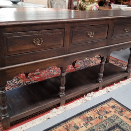 A very hard to find Vintage English kitchen dresser base of narrow proportions, sourced from France. In good original detailed condition.
