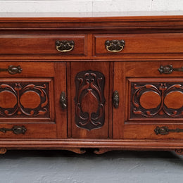 Beautiful decorative Art Nouveau sideboard with lovely handles and beautiful carved detailing. It is in good original detailed condition.